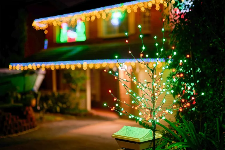 an exterior view of a Plano home with professional Christmas lighting by GroGreen
