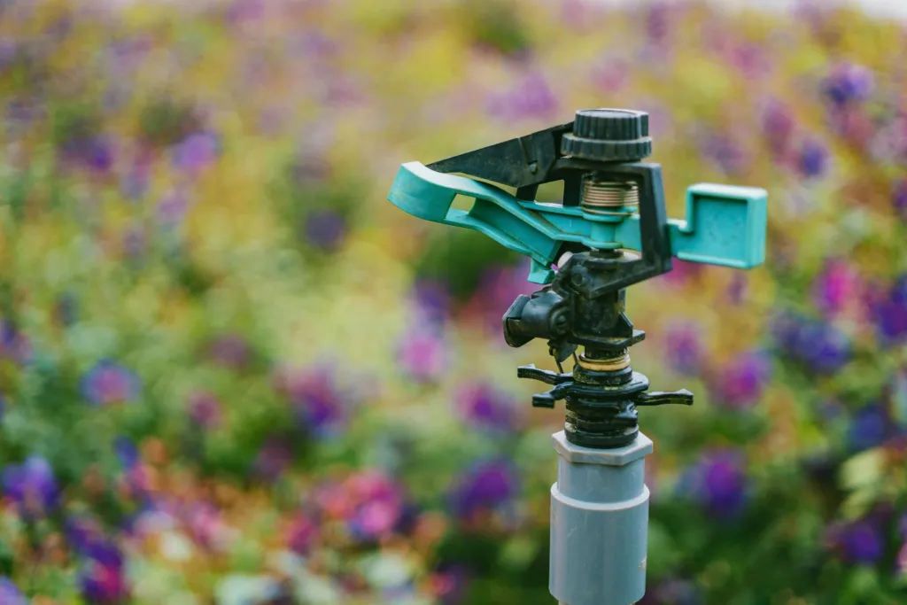 a close-up of a repaired sprinkler head in a yard
